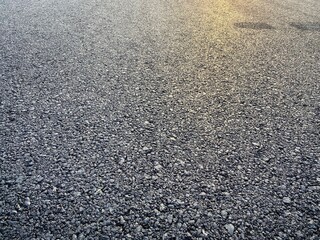 Sunlight on grunge empty asphalt street texture