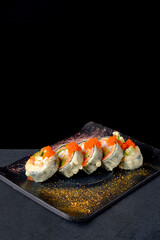 fried sushi  on the dark background