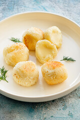 fried mozzarella balls on white plate