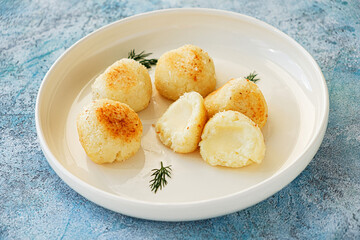 fried mozzarella balls on white plate