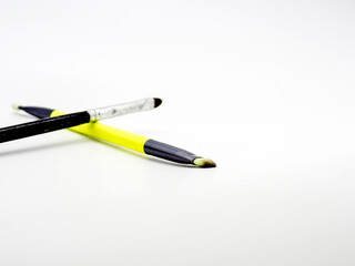 eyelash makeup brushes on white background