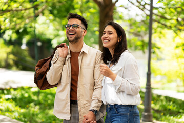 Happy young couple outdoors. Loving couple walking in the city.