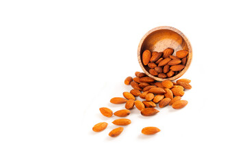 Almonds  in wooden bowl  isolated on white background with copy space.