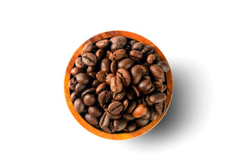 Roasted coffee beans in wooden bowl  isolated on white background.