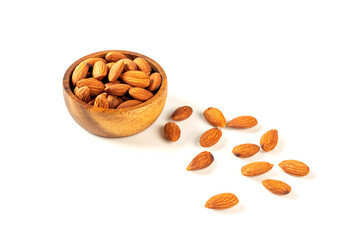 Almonds  in wooden bowl  isolated on white background with copy space.