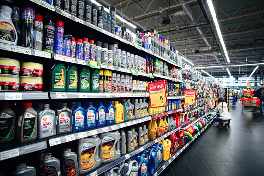 Minsk, Belarus. Feb 2021. Motor oils, car lubricants and additives in large supermarket. Assortment of car care products and accesories in auto parts store