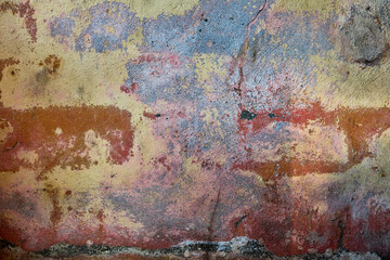Distressed wall with damp and worn out paint