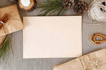 Empty vintage paper with Christmas decorations on table background mockup