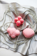 christmas gift concept. Christmas candle made from natural soy wax and spruce branches with garlands 