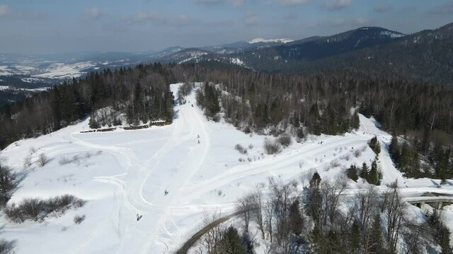 Aerial view of a participant in a biathlon race. Athlete overcomes the distance on skis.