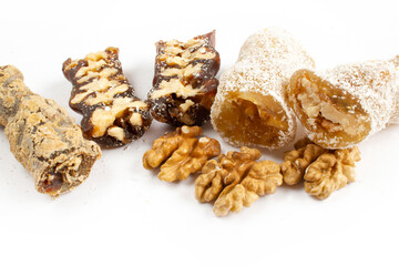 Walnuts on a string dipped in starch grape molasses. Churchkhela. Walnut sujuk.