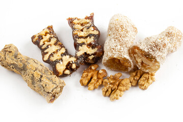 Walnuts on a string dipped in starch grape molasses. Churchkhela. Walnut sujuk.