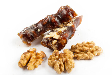 Walnuts on a string dipped in starch grape molasses. Churchkhela. Walnut sujuk.