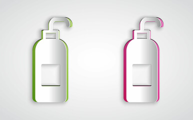 Paper cut Bottle of liquid antibacterial soap with dispenser icon isolated on grey background. Antiseptic. Disinfection, hygiene, skin care. Paper art style. Vector