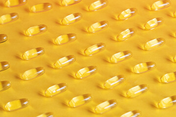 yellow capsules of omega fish