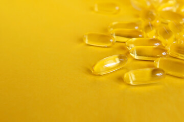 yellow capsules of omega fish