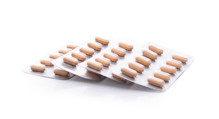 Pills in blister pack isolated on white background.