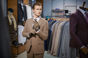 blond man in a boutique