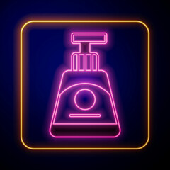 Glowing neon Cream or lotion cosmetic tube icon isolated on black background. Body care products for woman. Vector