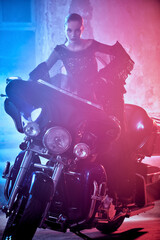 Naklejka na ściany i meble female model on motorbike