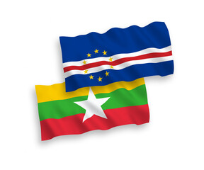 National vector fabric wave flags of Republic of Cabo Verde and Myanmar isolated on white background. 1 to 2 proportion.