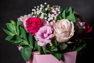 Beautiful bouquet of colorful rose flowers. Festive flowers concept.  Bouquet of fresh roses, freesias, eustoma and others.