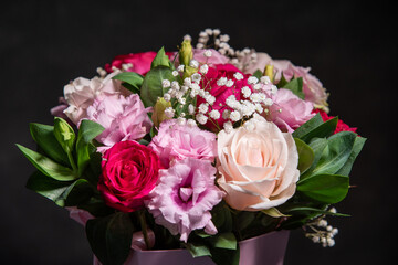 Beautiful bouquet of colorful rose flowers. Festive flowers concept. Bouquet of fresh roses, freesias, eustoma and others.