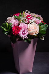 Beautiful bouquet of colorful rose flowers. Festive flowers concept. Bouquet of fresh roses, freesias, eustoma and others.