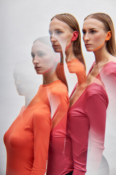 Multiple exposure of twin sisters by white background