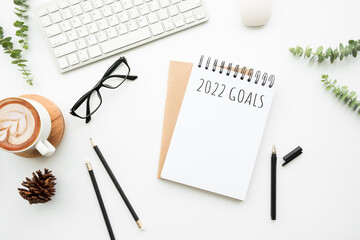 Notebook with 2022 goals text on it to apply new year resolutions and plan.
