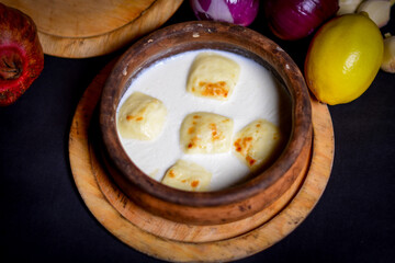 dairy products - delicious healthy dairy products on the table: sour cream in a white bowl, curd bowl, in a milk bowl