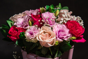 bouquet of pink roses on black