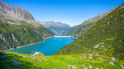 Fototapeta na wymiar Beautiful alpine walley with azure blue water dam
