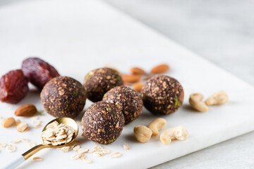Raw vegan energy balls with dates, nuts and oats. Raw vegan chocolate truffles - 472213170