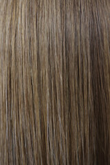 Naklejka premium Straight chestnut natural hair texture after dye procedure in salon
