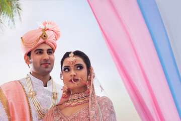 Indian bride and groom in traditional wedding dress