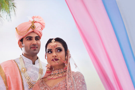 Indian bride and groom in traditional wedding dress