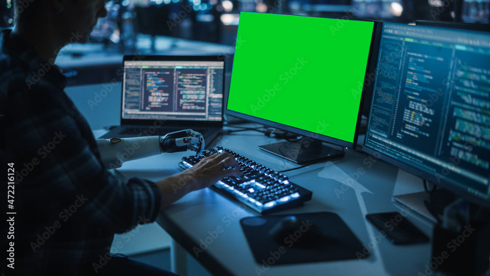 Poster Night Office: Person with Disability Using Prosthetic Arm to Work on Green Screen Chroma Key Computer. Swift and Natural Use of Myoelectric Bionic Hand To Type Code for Software at Night.