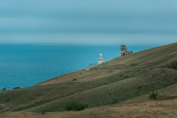 Fototapeta na wymiar Panoramic view of the sea hills and lighthouse