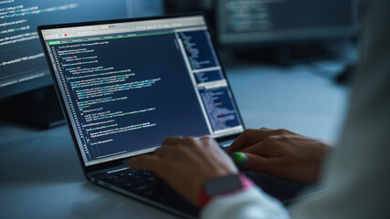 Close-up Focus on Person's Hands Typing on the Desktop Computer Keyboard. Screens Show Coding Language User Interface. Software Engineer Create Innovative e-Commerce App. Program Development