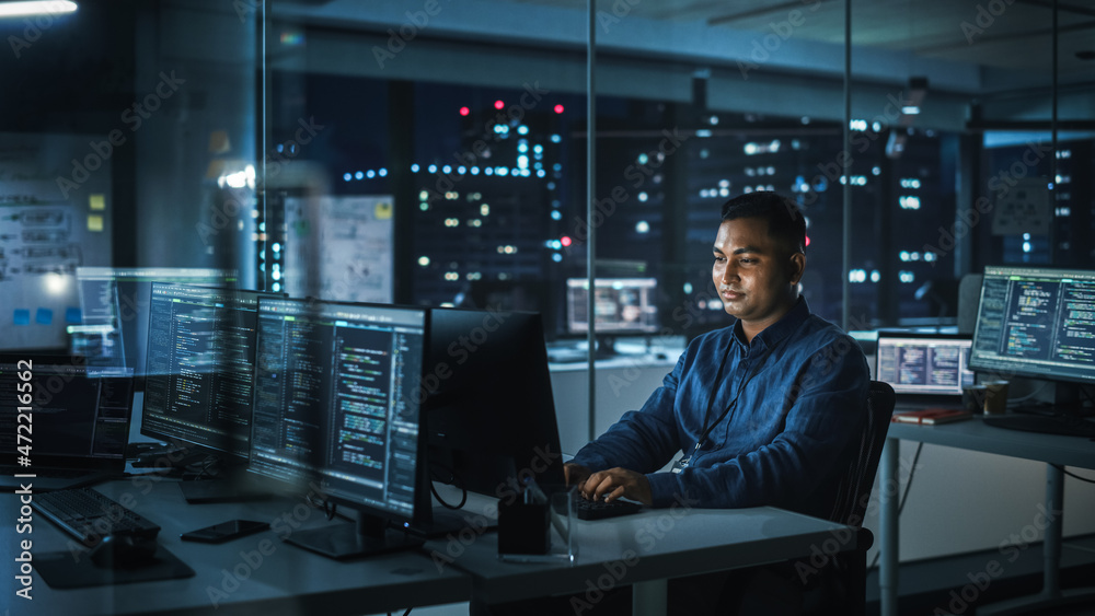 Poster Night Office: Portrait of Handsome Indian Man in Working on Desktop Computer. Digital Entrepreneur Typing, Creating Modern Software, e-Commerce App Design, Programming. Stylish Authentic Person