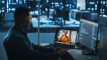 Remote Teamwork In Office at Night: Project Manager Talks with Creative Solutions Specialist Via Video Conference Call. International Startup Company Specialists Doing Online Meeting to Brainstorm