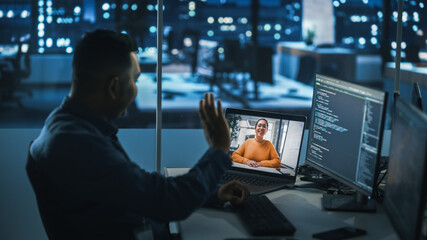 Remote Teamwork In Office at Night: Project Manager Talks with Creative Solutions Specialist Via Video Conference Call. International Startup Company Specialists Doing Online Meeting to Brainstorm