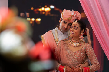 Portrait of an Indian wedding couple posing for album