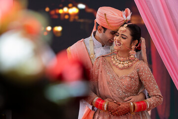Portrait of an Indian wedding couple posing for album