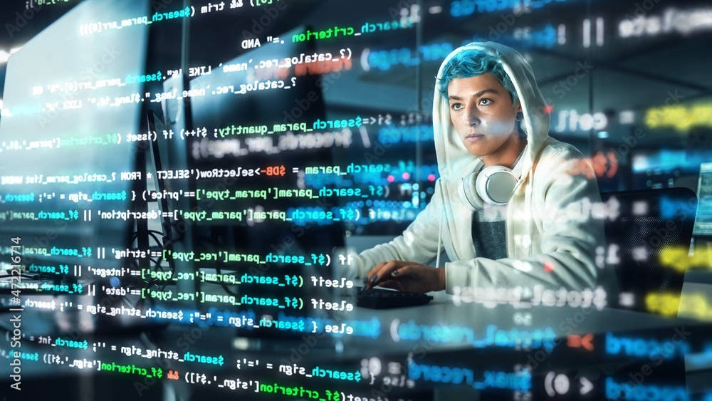Fototapete Late at Night in Office: Portrait of Young Stylish Freelancer Woman Working on Desktop Computer. Non-Binary Person Creating Modern Content. Shot with Visualisation of Running Script Code on Foreground