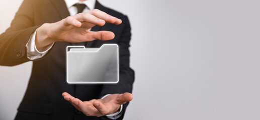 Businessman hold folder icon.Document Management System or DMS setup by IT consultant with modern computer are searching managing information and corporate files.Business processing,