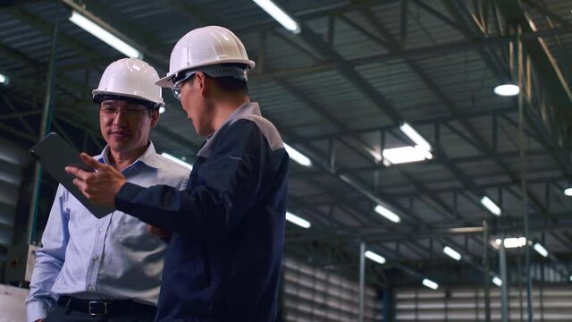 An engineer is explaining remote machine control to industrial owners.