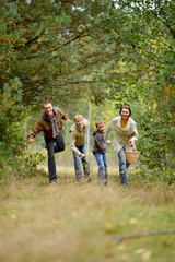 Portrait of family of four in park