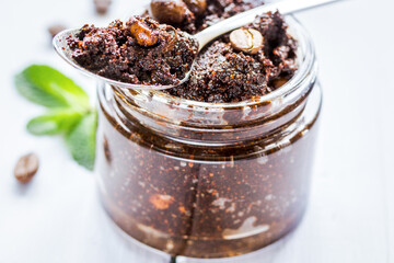 Spa concept with natural coffee scrub on wooden table background